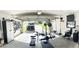 Spacious garage with workout equipment and ample storage, offering a versatile area at 1102 Peregrine St, Groveland, FL 34736