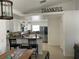 A bright kitchen with granite countertops, stainless steel appliances, and an adjacent dining area at 1102 Peregrine St, Groveland, FL 34736
