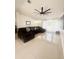 A modern living room featuring a comfortable sectional couch, lots of lighting, and tile floors at 1102 Peregrine St, Groveland, FL 34736