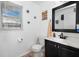 Clean bathroom featuring a black framed mirror and vanity with a black faucet at 1190 Sandestin Way, Orlando, FL 32824
