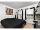 Bedroom featuring a neutral color scheme, large windows, and a simple yet elegant aesthetic at 1190 Sandestin Way, Orlando, FL 32824