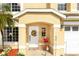 Charming front porch adorned with a decorative wreath and cozy seating, creating a welcoming entrance at 1190 Sandestin Way, Orlando, FL 32824