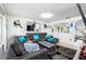 Comfortable living room with stylish gray sofa, modern decor, and a view into the outdoor pool area at 1190 Sandestin Way, Orlando, FL 32824
