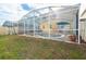 Backyard pool with screened enclosure and brick patio offers an inviting outdoor living space at 1190 Sandestin Way, Orlando, FL 32824