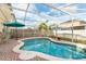 Inviting backyard pool with brick patio, outdoor seating, and a sunny screened enclosure at 1190 Sandestin Way, Orlando, FL 32824