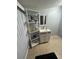 Bathroom vanity featuring decorative gold accents and white shelving for storage at 130 Avenue H Se, Winter Haven, FL 33880