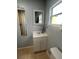 Charming bathroom with a decorative mirror and classic fixtures for a clean and timeless look at 130 Avenue H Se, Winter Haven, FL 33880