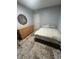 Neat bedroom with a dresser, decorative mirror, and cozy rug for a comfortable ambiance at 130 Avenue H Se, Winter Haven, FL 33880