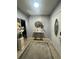 Home entryway with rug, art, and access to the rest of the home at 130 Avenue H Se, Winter Haven, FL 33880