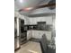 Modern kitchen boasting white cabinetry, stainless steel appliances, and granite countertops at 130 Avenue H Se, Winter Haven, FL 33880