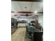 Spacious kitchen featuring stainless steel appliances, granite countertops, and eat-in dining area at 130 Avenue H Se, Winter Haven, FL 33880
