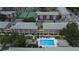 Aerial view showcases a community pool, tennis court, parking, and well-maintained complex at 131 Water Front Way # 220, Altamonte Springs, FL 32701