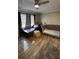 Living room with shiny hardwood floors, a ceiling fan, and comfortable seating at 131 Water Front Way # 220, Altamonte Springs, FL 32701