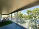 Large covered balcony provides a relaxing outdoor space with views of the surrounding landscape at 14963 Braywood Trl, Orlando, FL 32824