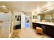 Luxurious bathroom featuring double sinks, a walk-in shower, and elegant decor, perfect for relaxation at 14963 Braywood Trl, Orlando, FL 32824
