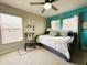 Cozy bedroom featuring a comfortable daybed, charming decor, and natural light streaming through the window at 14963 Braywood Trl, Orlando, FL 32824