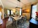 Charming dining area featuring stylish lighting and open layout to living areas, great for hosting gatherings at 14963 Braywood Trl, Orlando, FL 32824