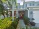 Charming two-story home boasts well-maintained landscaping, covered entry, and a welcoming facade at 14963 Braywood Trl, Orlando, FL 32824
