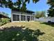 A spacious backyard and screened in patio, perfect for entertainment and relaxation at 14963 Braywood Trl, Orlando, FL 32824