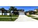 Well-maintained two story home featuring a manicured lawn and symmetrical landscaping for enhanced curb appeal at 14963 Braywood Trl, Orlando, FL 32824