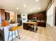 Spacious kitchen featuring an island with seating, stainless steel appliances, and ample counter space at 14963 Braywood Trl, Orlando, FL 32824