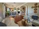 Open-concept living room with hardwood floors and seamless flow to the dining area for entertaining at 14963 Braywood Trl, Orlando, FL 32824