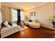Comfortable living room with hardwood floors, neutral decor, and lots of light offering a relaxing atmosphere at 14963 Braywood Trl, Orlando, FL 32824