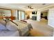 Serene main bedroom featuring neutral tones, ample natural light, and an adjoining sitting area at 14963 Braywood Trl, Orlando, FL 32824