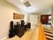 Upstairs landing with office space, computer, desk, and a guitar at 14963 Braywood Trl, Orlando, FL 32824