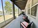 Relaxing screened-in patio with comfortable seating and view of the lake, ideal for outdoor enjoyment at 14963 Braywood Trl, Orlando, FL 32824