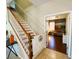Inviting staircase with wooden railings, and modern decor, offering a glimpse into a cozy living space at 14963 Braywood Trl, Orlando, FL 32824