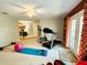 Large workout room with multiple exercise machines and a pink yoga ball at 14963 Braywood Trl, Orlando, FL 32824