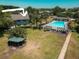 A community pool and gazebo surrounded by green space offer attractive amenities for residents at 1695 Lee Rd # E215, Winter Park, FL 32789