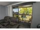 Relaxing balcony with outdoor seating and a view of lush greenery, ideal for enjoying fresh air at 1695 Lee Rd # E215, Winter Park, FL 32789