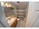 Bathroom featuring a vanity, mirror, a shower with a patterned curtain, and tile flooring at 1695 Lee Rd # E215, Winter Park, FL 32789