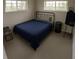 Serene bedroom with natural light, comfortable bed, and minimalist decor for a restful atmosphere at 1695 Lee Rd # E215, Winter Park, FL 32789