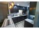 Stylish kitchen featuring dark cabinets, stainless steel appliances, modern countertops and a beautiful backsplash at 1695 Lee Rd # E215, Winter Park, FL 32789