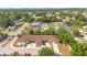 Aerial view of a residential area featuring well-kept townhomes with private driveways and verdant surroundings at 1773 Barton Towne Cir, St Cloud, FL 34769