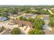 Aerial view showcasing a well-maintained townhome community with lush greenery and convenient street parking at 1773 Barton Towne Cir, St Cloud, FL 34769
