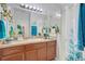 Well-lit bathroom featuring a clean design, a large mirror, and white shower at 1773 Barton Towne Cir, St Cloud, FL 34769