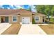 Charming single-story townhome featuring a well-maintained lawn, driveway, and an attached one-car garage at 1773 Barton Towne Cir, St Cloud, FL 34769
