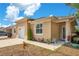 Charming home exterior with a well manicured lawn, and lovely garden decor at 1773 Barton Towne Cir, St Cloud, FL 34769