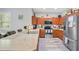Beautiful kitchen featuring stainless steel appliances, hardwood cabinets, and modern countertops at 1773 Barton Towne Cir, St Cloud, FL 34769