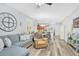 Inviting living room featuring an open-concept design, recessed lighting, and wood floors at 1773 Barton Towne Cir, St Cloud, FL 34769