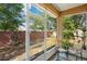 Inviting screened patio with comfortable seating overlooking the fenced backyard and lush greenery at 1773 Barton Towne Cir, St Cloud, FL 34769