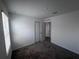 An open carpeted room provides flexibility and can be easily customized with the windows allowing natural light at 1796 Foreman Rd, Eagle Lake, FL 33839