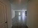 An open concept living area with luxury vinyl floors that leads to a modern kitchen with stainless steel appliances at 1796 Foreman Rd, Eagle Lake, FL 33839