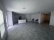 Open concept living and dining area with view into kitchen, stainless steel appliances and lots of natural light at 1796 Foreman Rd, Eagle Lake, FL 33839