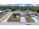 Neighborhood aerial view featuring single-Gathering homes, two-car garages, lawns and mature trees at 199 Maple Dr, Kissimmee, FL 34759