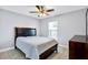 Bedroom featuring a ceiling fan, window, and a classic dresser at 199 Maple Dr, Kissimmee, FL 34759